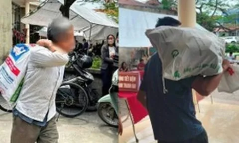 Người dân vác bao tải đi đựng tiền đền bù đất siêu dự án Olympic